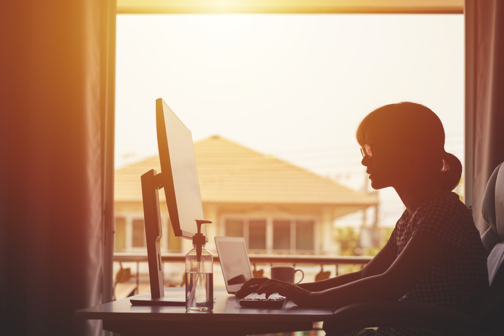 business owner reading on computer about adaptability