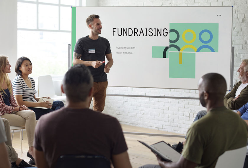 CFO reviewing plan with team before fundraising event