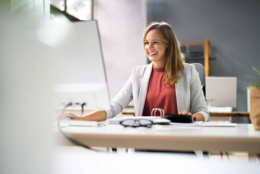 Financial Controller reviewing compliance documents and verifying all information entered is correct