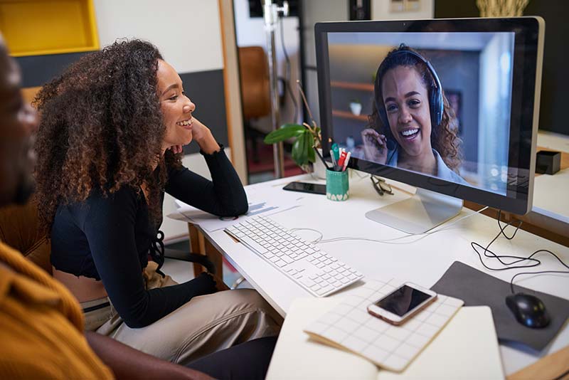 leader managing a hybrid team online during a recession