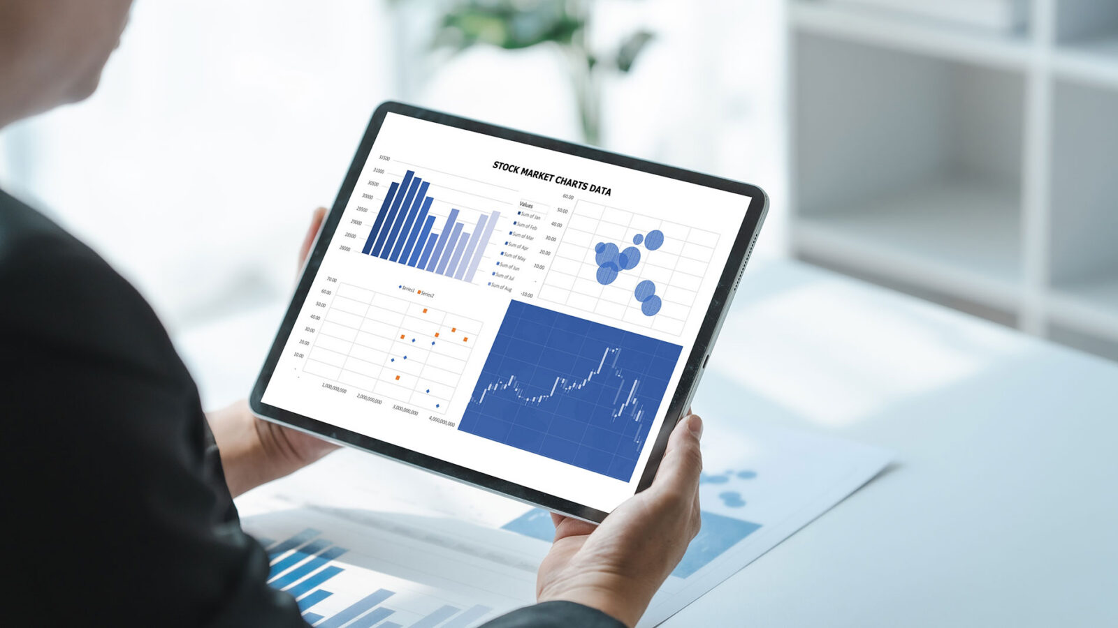 businesswoman holding tablet with company Accounting trends and predictions for 2024