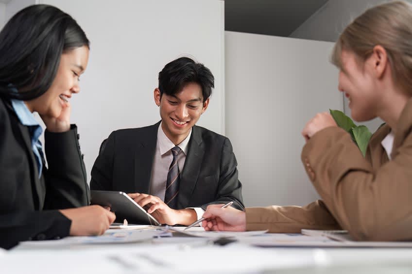 Diverse team working on financial planning and analysis project for company abroad