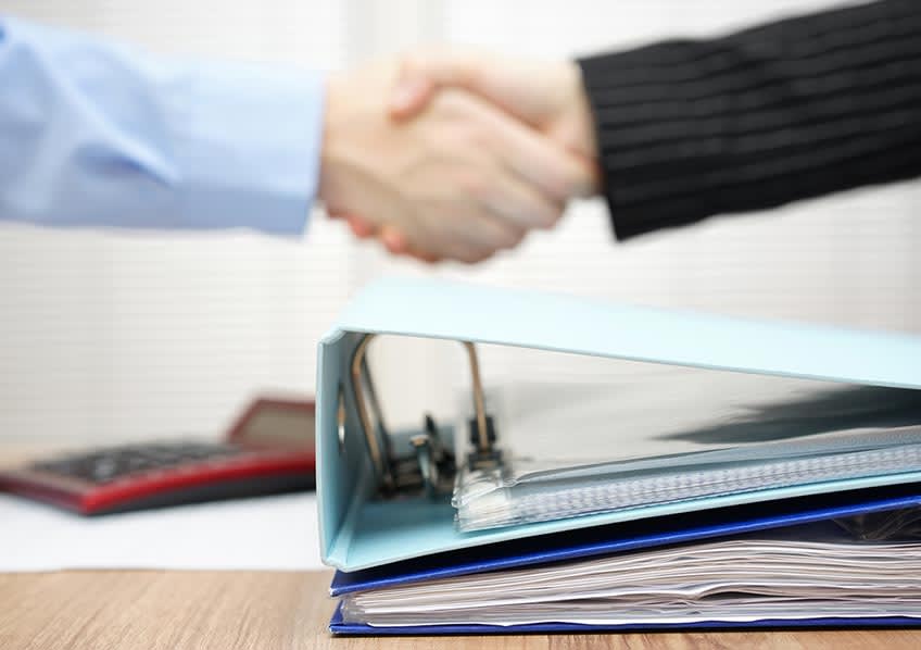 real estate agent closing deal with accounting outsourcing representative