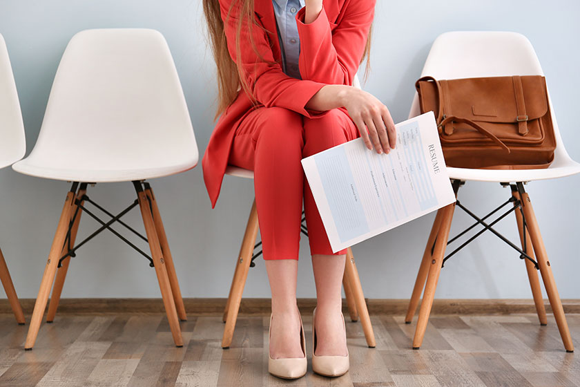 Woman sitting with resume in hand