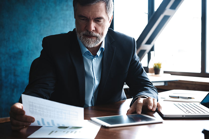 cfo analyzing financial data while contemplating how much his role has evolved