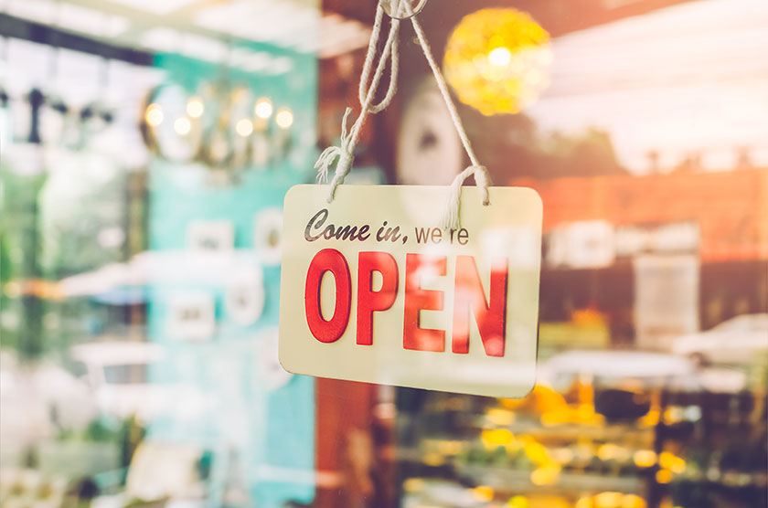 Open sign hung on business door