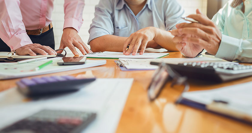 accountants calculating benefits of accounting automation