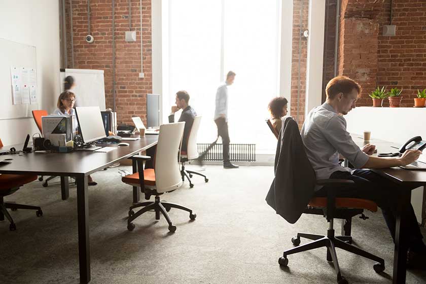 evolution outsourcing team working on different tasks in office