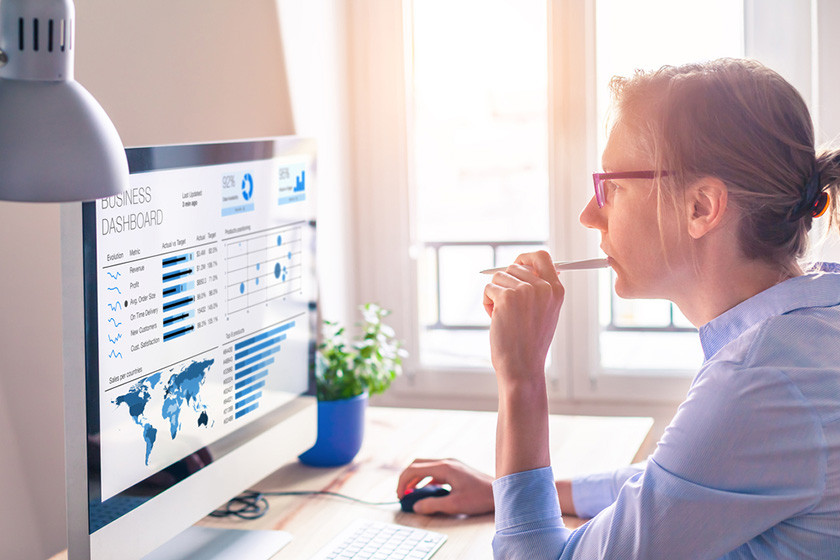 finance vp accessing survey results on her computer 
