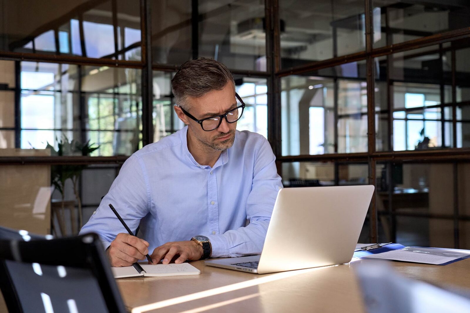 finance controller studying about his evolving role at computer