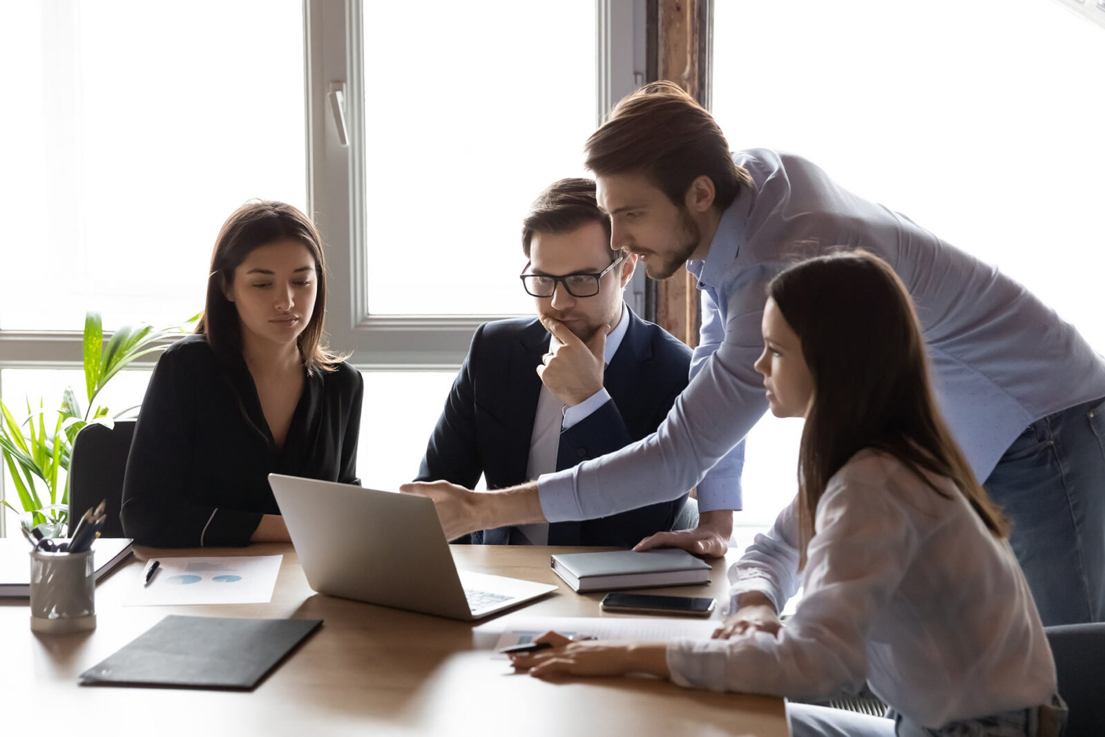 executive business leadership team asking accounting automation questions to provider via chat on computer