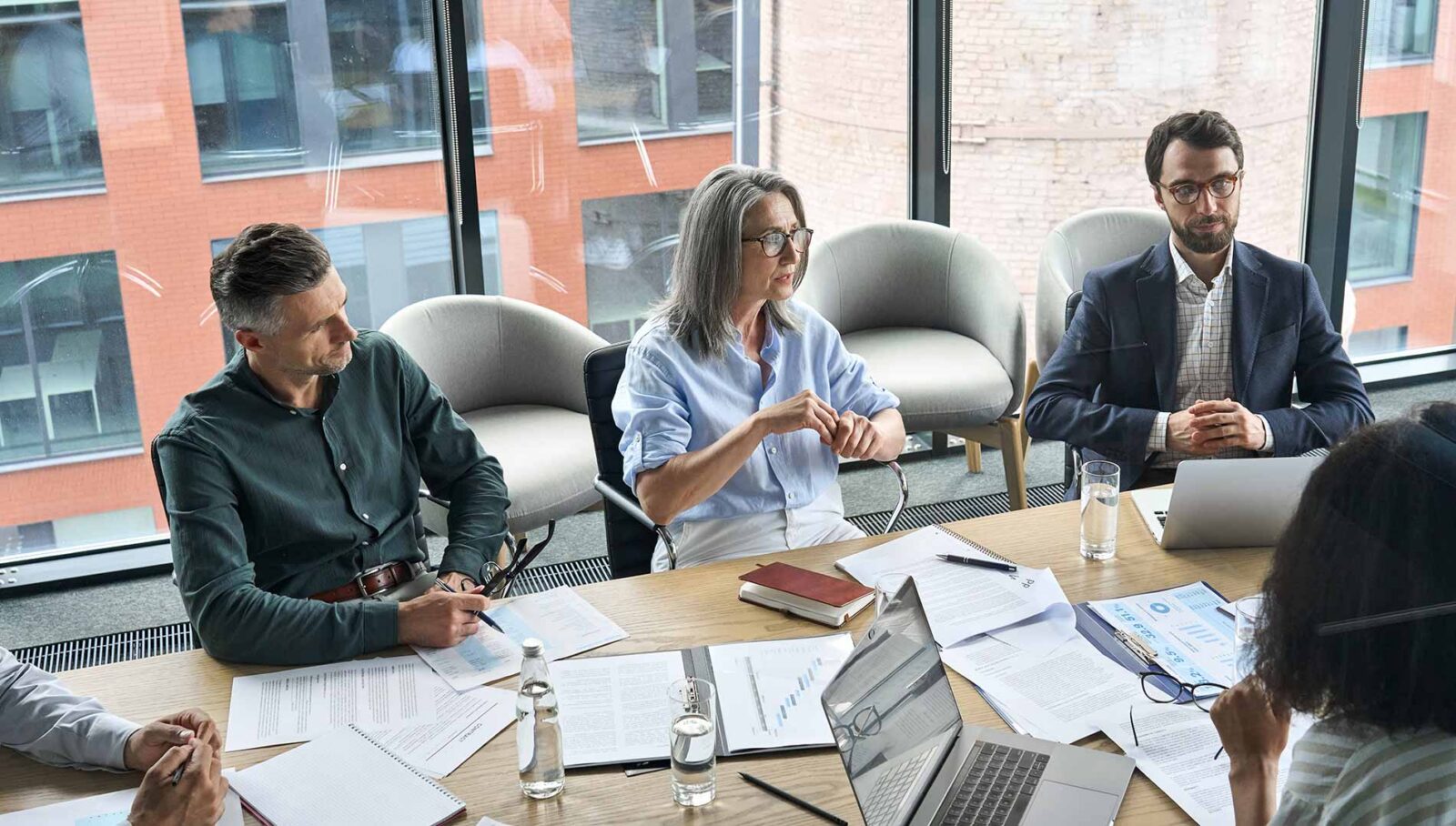 finance team discussing outsourcing vendor options as a strategy to future-proof their department