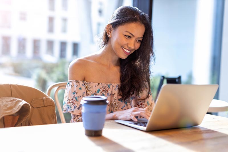 filipina studying on company provided laptop