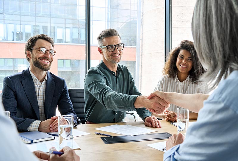 business team meeting with parent company after merger and acquisition