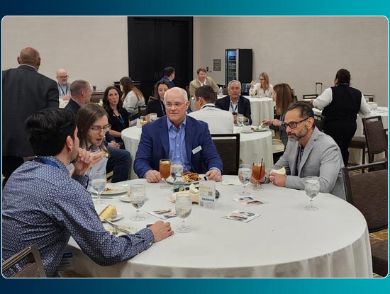 Event attendees talking about CFO lessons learned and networking